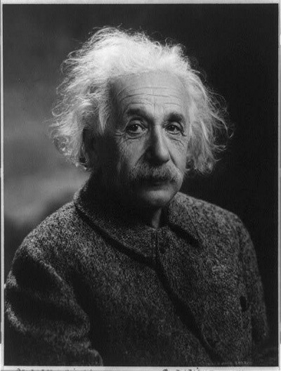 Photo of Albert Einstein in portrait, with white hair, looking a bit gloomy