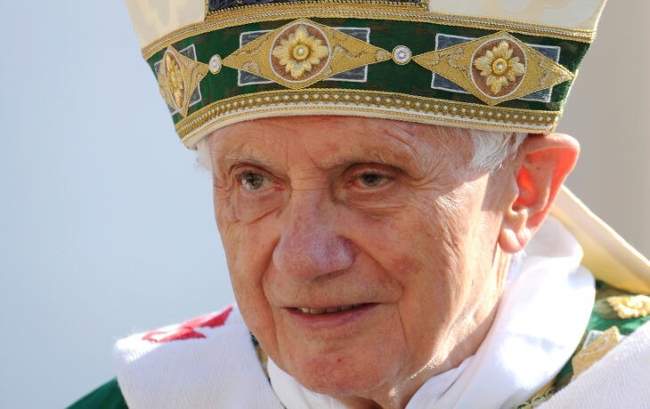 Photo of Pope Benedict XVI in his green miter and robes, looking older