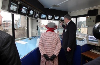 Photo of Queen Elizabeth seen from behind in the control tower at London Bridge