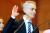 Photo of Rahm Emmanuel raising his right hand, with part of a middle finger gone