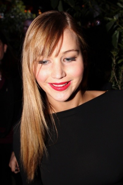 Photo of Jennifer Lawrence in red lipstick with her hair swept down