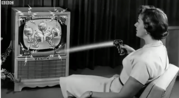 An old advertising image of a 1950s woman holding a remote control and 'zapping' a TV commercial for beer