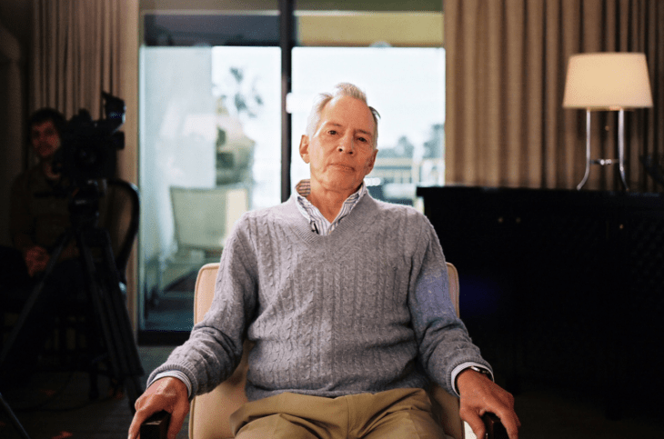 Photo of Robert Durst in a gray sweater, staring calmly at the camera