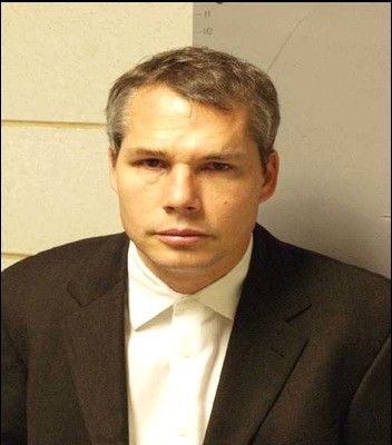 Mugshot of Shepard Fairey, all dressed up