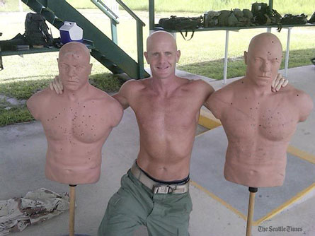 Photo of a skinny bald FBI agent shirtless, between two bald target dummies