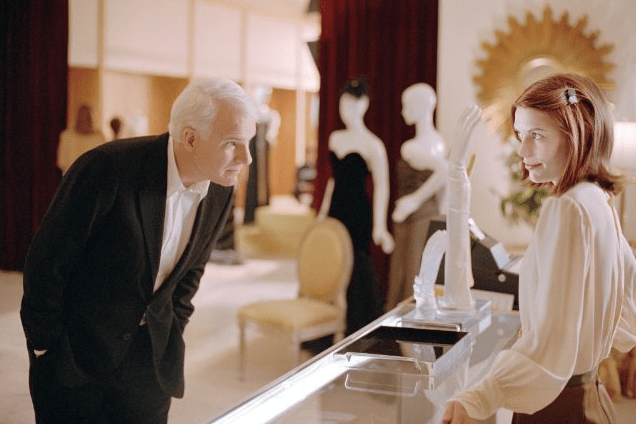 Photo of Claire Danes showing Steve Martin some gloves in 'Shopgirl'