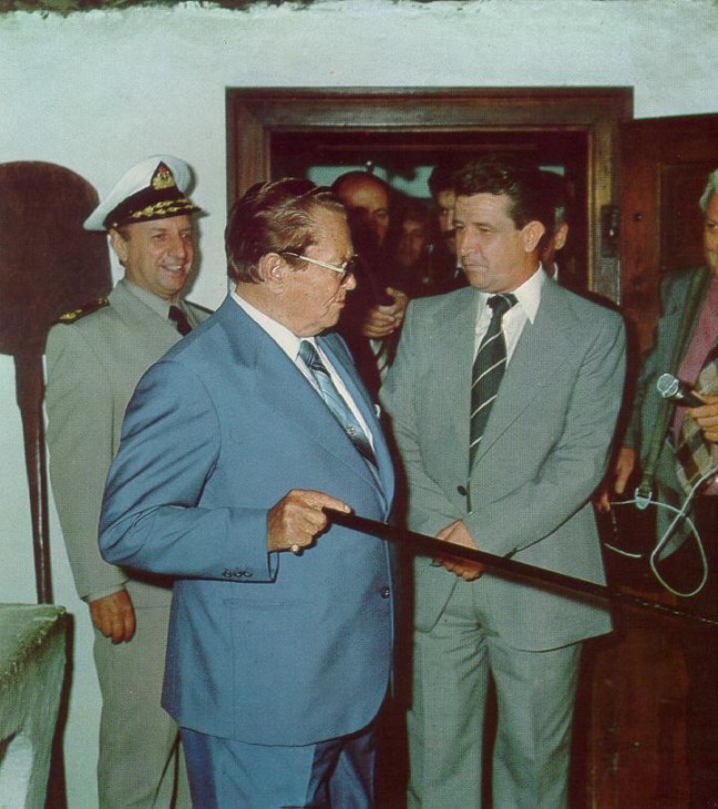 Tito jabbing with his cane