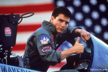 Photo of Tom Cruise giving a cocky thumbs-up from his airplane cockpit