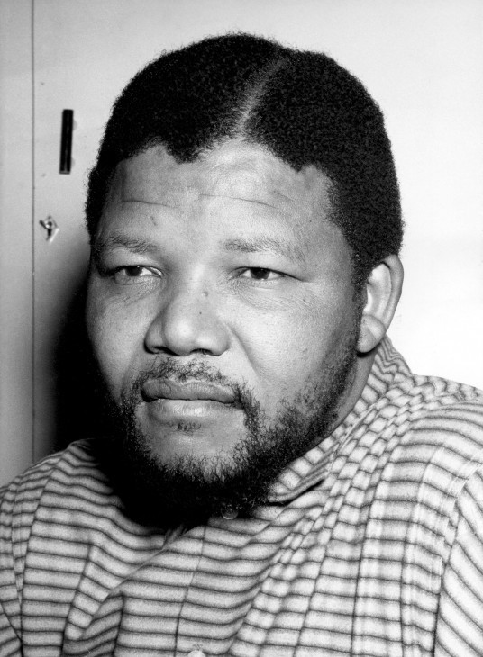 A photo of Nelson Mandela as a young man, rather hefty, with light beard
