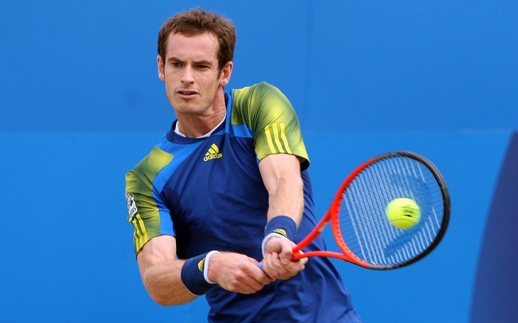 Photo of Andy Murray in blue, hitting a backhand with two hands