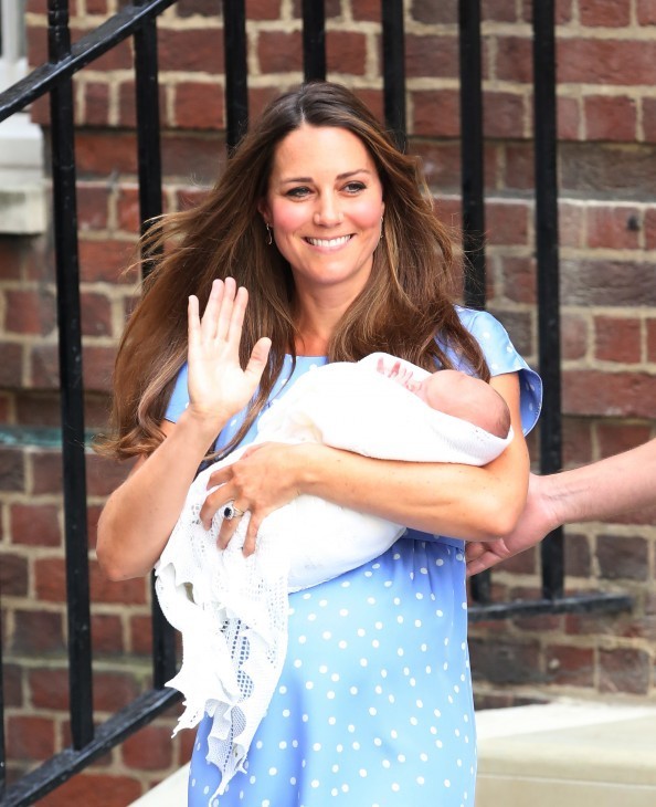 Royal baby photo with Catherine holding the baby and smiling and waving beautifully