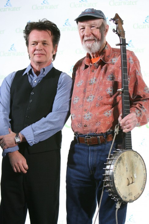 Pete Seeger (r) with John Mellencamp at the 'Clearwater Concert' benefit on Seeger's 90th birthday in 2009. (Photo: WENN)