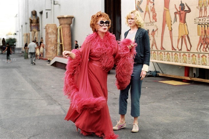 Shirley Maclaine in a silly pink feathered dress in 'Bewitched,' looking ridiculous