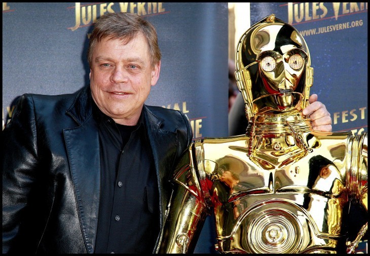 Mark Hamill and C-3P0, posing together on the red carpet