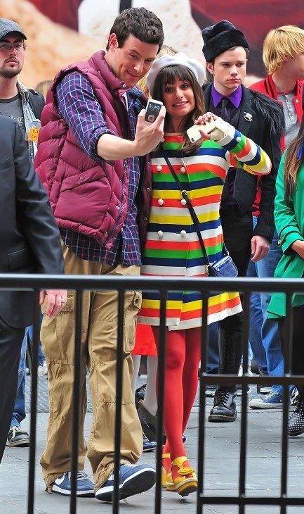 Cory Monteith and Lea Michele smile as they take photos of themselves