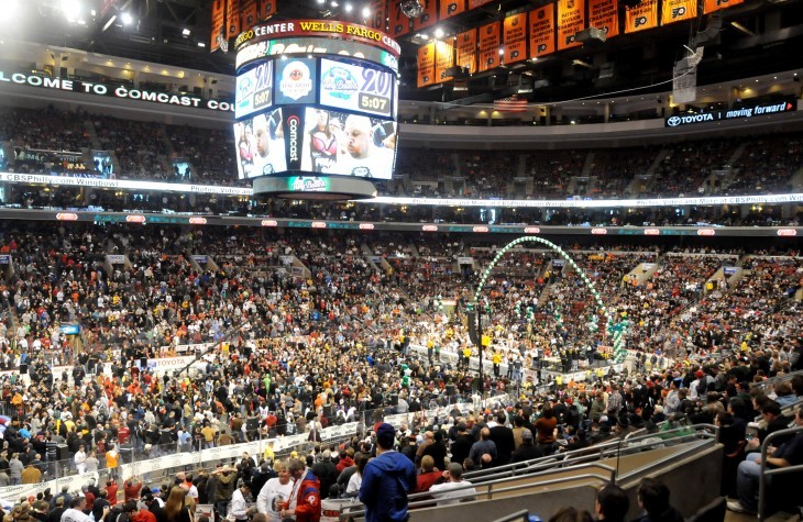A huge sports arena filled with fans and competitive wing eaters