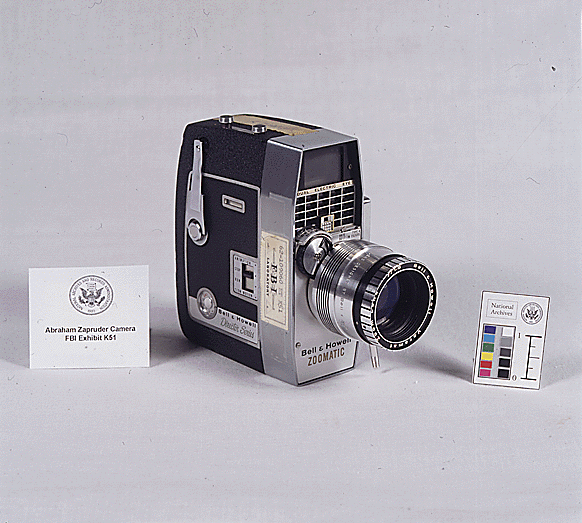 Photo of Abraham Zapruder's old home movie camera, boxy black with silver metal fittings and a lens about three inches long