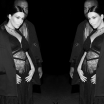 Photo of Kim Kardashian pregnant, flanked by Kanye West