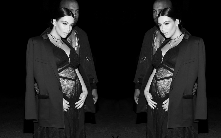 Photo of Kim Kardashian pregnant, flanked by Kanye West