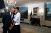 President Barack Obama and his wife Michelle share a moment in the Oval Office of the White House. Official White House photo by Pete Souza.