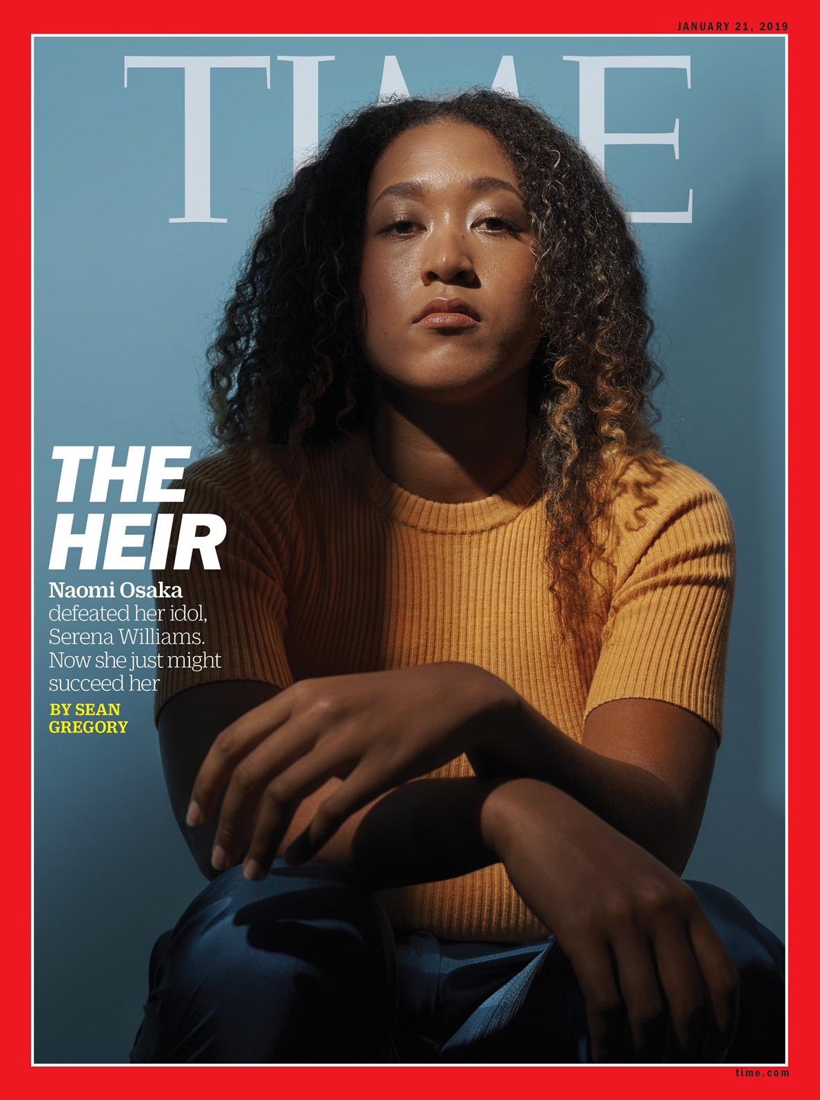 Naomi Osaka in a sweater, looking actually kind of stern at the camera
