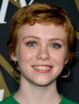 Sophia Lillis is a blue-eyed (and wide-eyed) redhead with a bright smile.