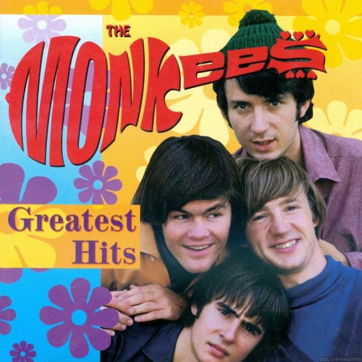 A flower-power graphic with a photo of all four Monkees