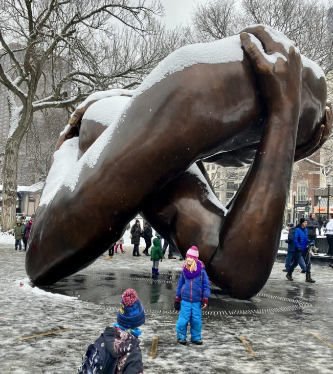 A 12-foot-tall bronze statue of arms embracing