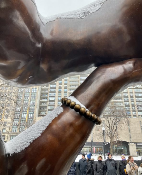 A 12-foot-tall bronze statue of arms embracing