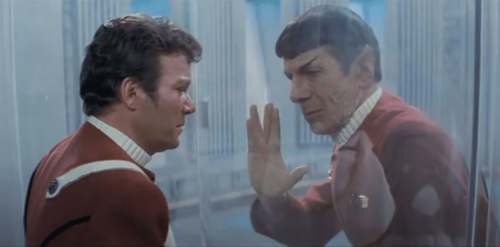 Spock gives the vulcan salute from inside a glass radiation chamber